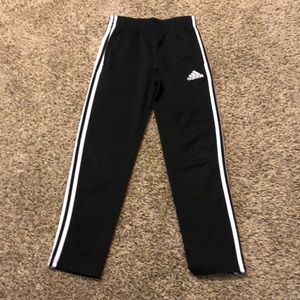 Black and white adidas pants